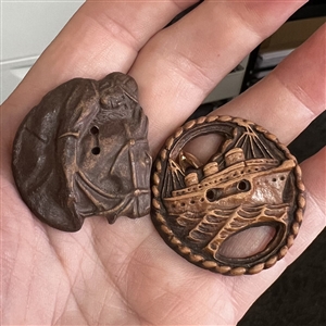 Two Burwood buttons of transportation.