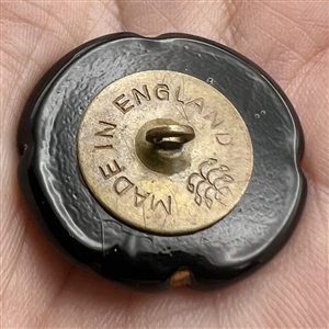 Bimini black glass button of a man on horseback. 