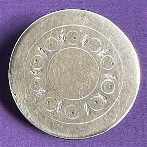 An 18th c. Tombac button with center designs.