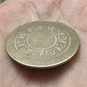 An 18th c. Tombac button with center designs.