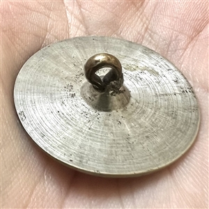 An 18th c. Tombac button with center designs.