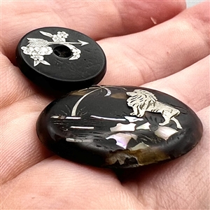 Two inlay buttons.