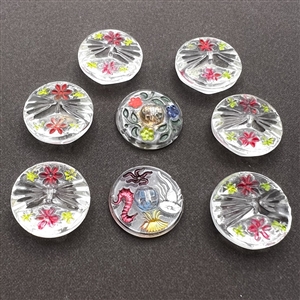 Eight Bohemian reverse painted glass buttons.