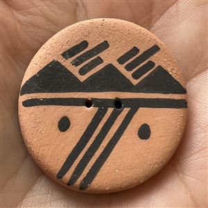 Navajo ceramic pottery button of a scene.