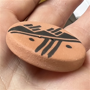 Navajo ceramic pottery button of a scene.