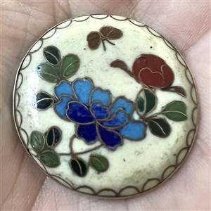 Cloisonné enamel button of flowers.