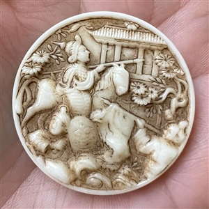 “Genghis Khan” sepia tinted white glass rosette shank button.