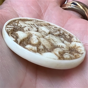 “Genghis Khan” sepia tinted white glass rosette shank button.