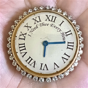 Bob Benson studio button of of a clock face.