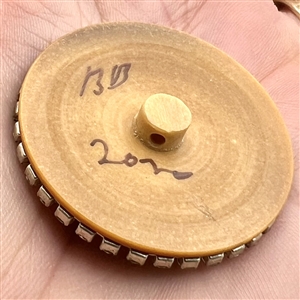 Bob Benson studio button of of a clock face.