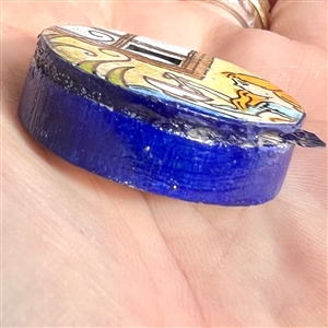 Movable show favor button of “Little Miss Muffet by Grace Bauman.