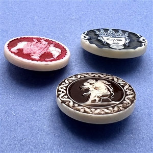 Three Artid Vintage plastic buttons of assorted subjects.