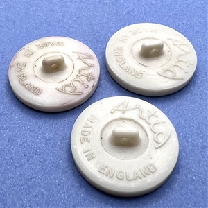 Three Artid Vintage plastic buttons of assorted subjects.