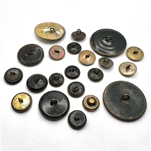 Twenty one assorted brass buttons of hands holding flowers.