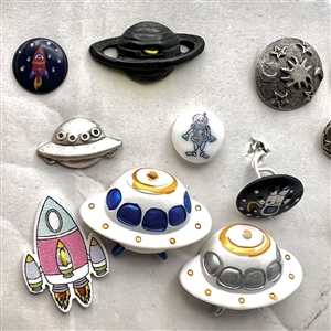 Card of fifteen assorted “space” themed buttons.