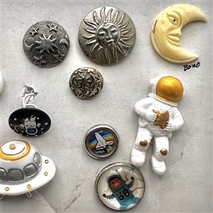 Card of fifteen assorted “space” themed buttons.