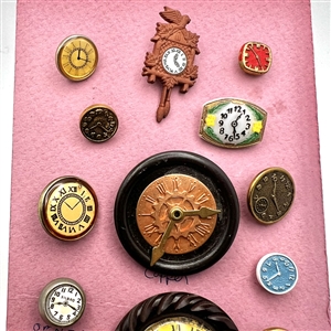 Card of twenty six clock buttons.
