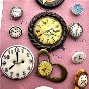 Card of twenty six clock buttons.