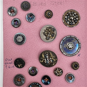 Card of thirty four blued steel buttons.