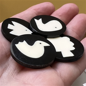 Four polyester cookie buttons of assorted subjects.