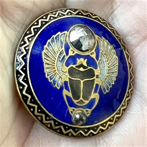 Enamel button of an Egyptian scarab beetle.