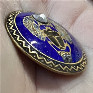 Enamel button of an Egyptian scarab beetle.