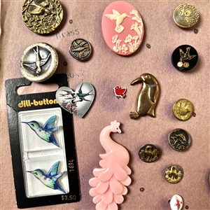 Card of forty three bird buttons. 