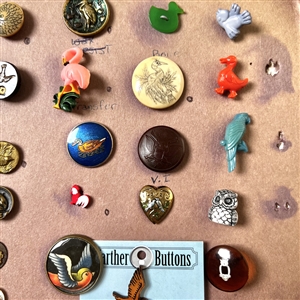 Card of forty three bird buttons. 