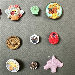 Card of twenty seven container buttons.