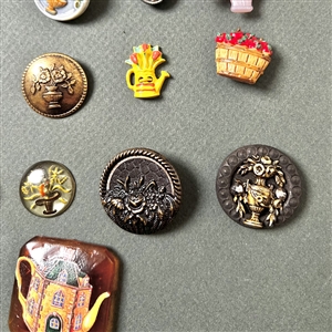 Card of twenty seven container buttons.
