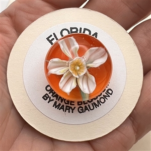 Stunning show favor button by Mary Gaumond - glass paperweight studio button of a 3D orange blossom.