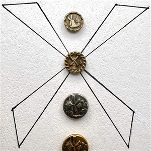 Card of ten windmill buttons. 