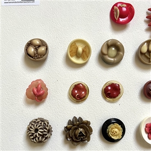 Card of twenty four celluloid buttons.