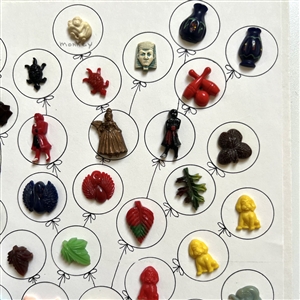Card of forty two Vintage plastic goofie buttons. 