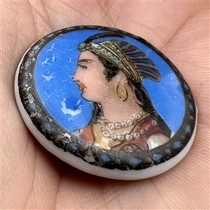 Liverpool transfer button of an Indian woman in a headdress.