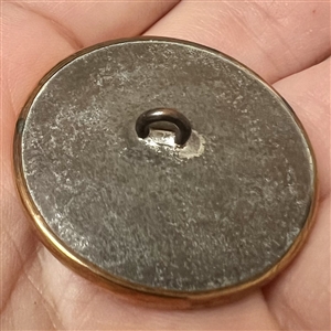 An 18th c. Reverse painted glass of an urn over silvered liner button.