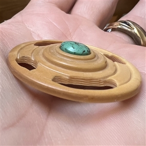 Studio button with turquoise center by Bob Benson. 