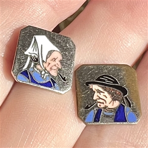 Two 20th c. French silver buttons with enamel of a country couple smoking pipes.