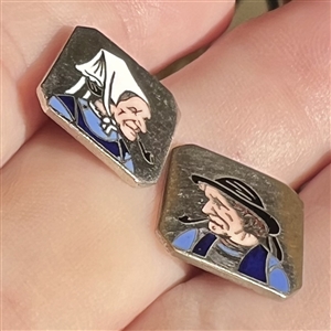 Two 20th c. French silver buttons with enamel of a country couple smoking pipes.