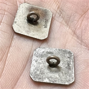 Two 20th c. French silver buttons with enamel of a country couple smoking pipes.