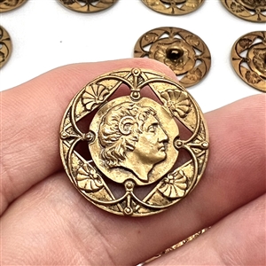Set of twenty one brass buttons with openwork.