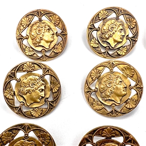 Set of twenty one brass buttons with openwork.