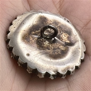 An 18th c. Transitional églomisé of Zeus with paste border in silver button.