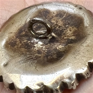 An 18th c. Transitional églomisé of Zeus with paste border in silver button.