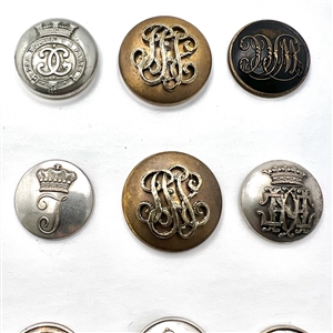 Twelve Livery buttons of monograms and initials.