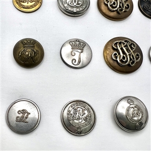 Twelve Livery buttons of monograms and initials.