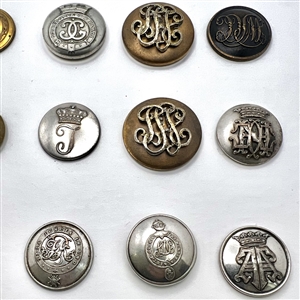 Twelve Livery buttons of monograms and initials.
