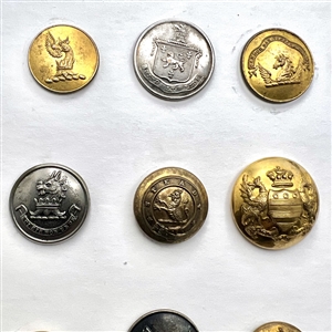 Fifteen Livery buttons depicting fabulous creatures.