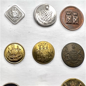 Twenty assorted Livery coat of arms buttons and one Scottish kilt button.