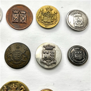 Twenty assorted Livery coat of arms buttons and one Scottish kilt button.